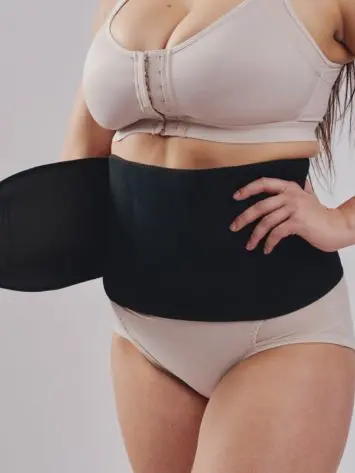 BodyAid black abdominal binder with self-adjusting velcro closure. Hernia and abdominal support.