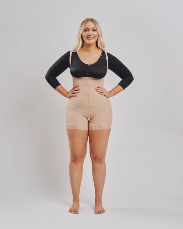 BodyAid boy leg bodysuit in beige with front zip. Surgical grade compression ideal for all abdominal and fat transfer procedures. Featured with BodyAid arm compress crop in black.