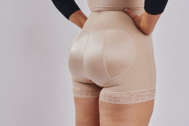 BodyAid Stage 1 boyleg bodysuit in beige with front zip and non roll lace hem. Non compressive butt lift shape support. Perfect for BBL and fat transfer.BodyAid arm compress crop in black.