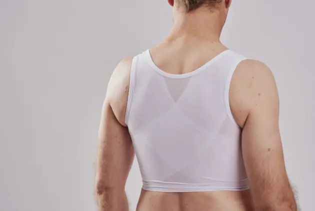 BodyAid chest compression binder in white. Features targeted posture support bands.