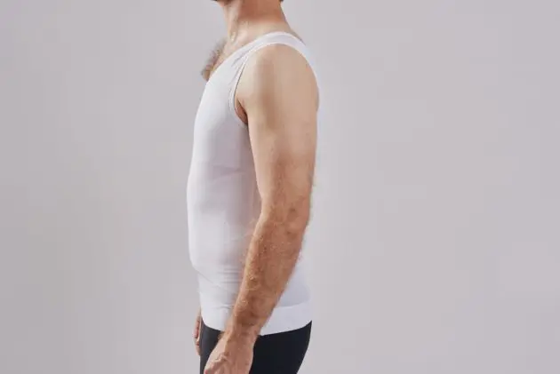 BodyAid male body slimmer in white for compression to the entire torso. Strategic support bands for better posture. Side view.