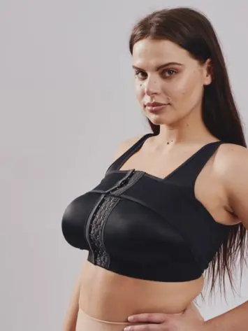 BodyAid stabilizer bra in beige. Adjustable front hook & eye closure. One cup fits all. Removable adjustable stabilizer band for implant placement post surgery.