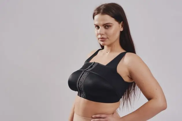 BodyAid stabilizer bra in beige. Adjustable front hook & eye closure. One cup fits all. Removable adjustable stabilizer band for implant placement post surgery.