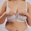 Leonisa posture bra with rear criss-cross support bands in beige. Front hook and eye closure and a smooth contouring finish.
