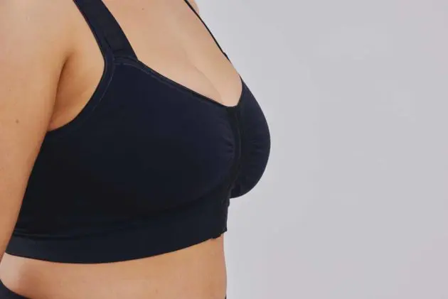 BodyAid black soft front fastening comfortable post op bra. Features adjustable straps. Side view.